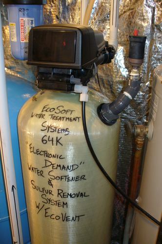 Close-up of an EcoSoft 64K water softener and sulfur removal system tank with EcoVent