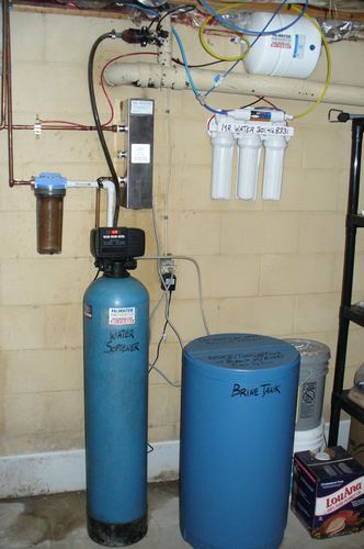 UV disinfection system, reverse osmosis filters, water softener, and brine tank installed together