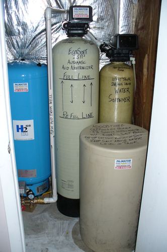EcoSoft acid neutralizer, Well-X-Trol pressure tank, and water softener installed in a closet