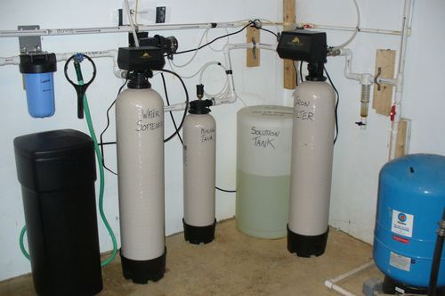 TurboSoft water softener, mixing tank, solution tank, and iron filter installed together