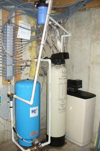EcoSoft acid neutralizer with a pressure tank and distribution manifold
