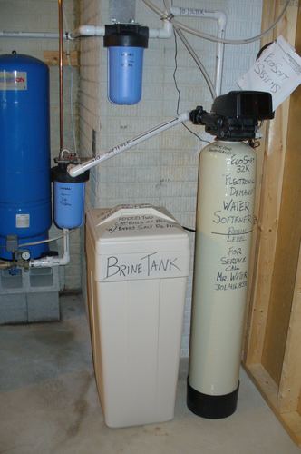 EcoSoft 32K water softener with dual whole-house filters and a brine tank