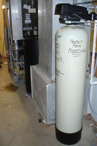 Water filtration and softener tanks installed in a commercial building