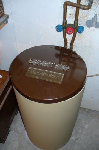 Well pump, pressure tank, and copper plumbing routed to a UV light and the house