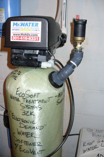 Close-up of a Mr. Water LLC branded control valve on an EcoSoft water softener