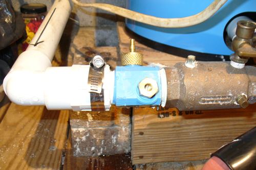Close-up of a plumbing shutoff valve and fitting installation