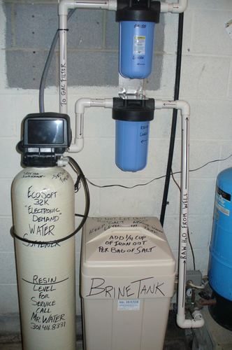 EcoSoft 32K water softener with dual whole-house filters and a brine tank