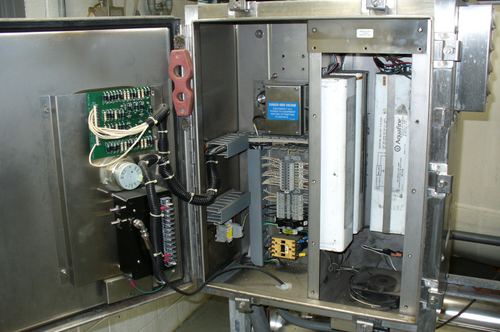 Close-up of Aquafine UV lamp ballasts inside a commercial disinfection cabinet