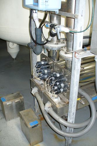 Close-up of a commercial water treatment control valve manifold