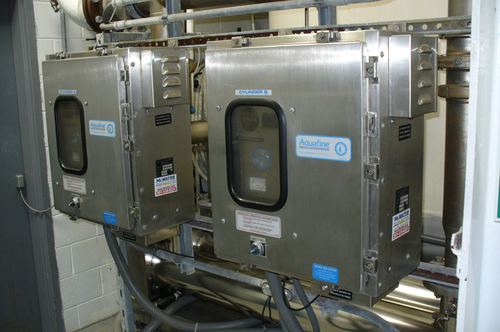 Close-up of commercial Aquafine UV disinfection cylinder cabinets
