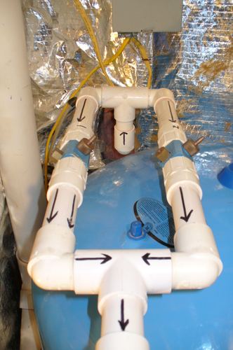 Close-up of dual micronizer fittings on a pressure tank