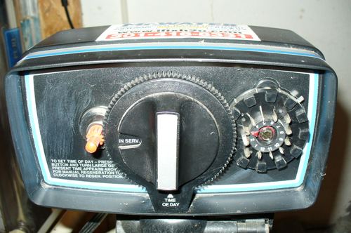 Close-up of a water softener control valve timer dial