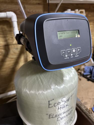 Close-up of a digital water softener control display