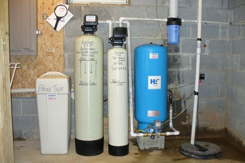 EcoSoft acid neutralizer, water softener, brine tank, and pressure tank installed together