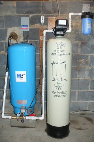 EcoSoft acid neutralizer, pressure tank, and carbon filter installed together