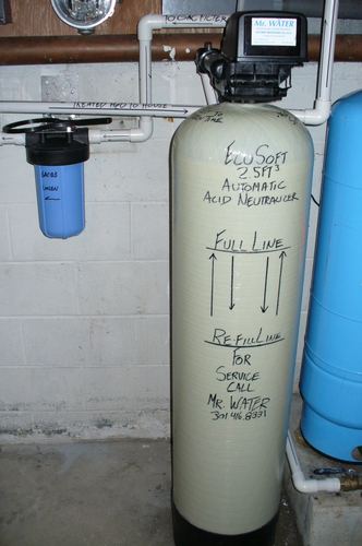 Two water softener systems with a brine tank and carbon filter installed together