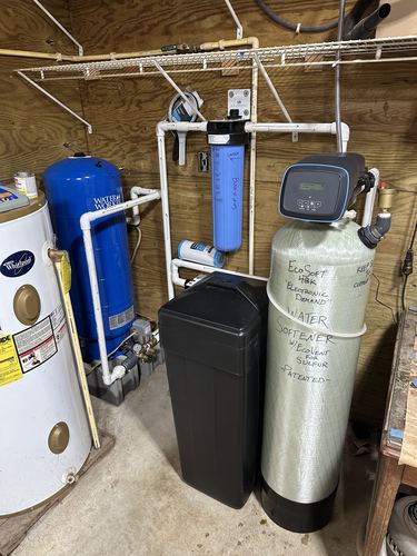 EcoSoft 48K water softener with whole-house filters and a pressure tank