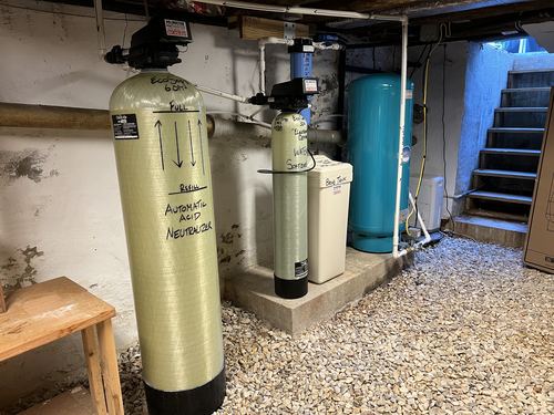 EcoSoft acid neutralizer, water softener, brine tank, and pressure tank installed together
