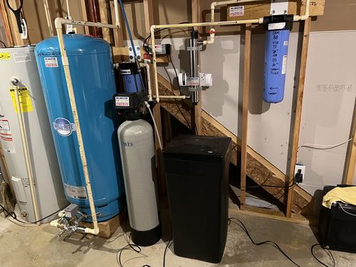 Well-Rite pressure tank, water softener, and UV light system installed in a basement