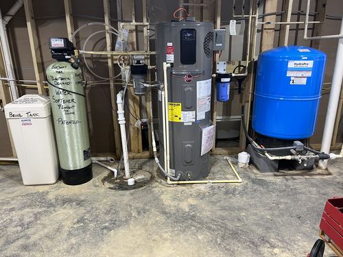 EcoSoft 48K water softener, brine tank, water heater, and pressure tank installed together