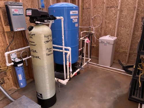 EcoSoft 64K water softener with a Well-X-Trol pressure tank and brine tank