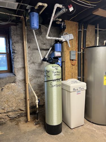 EcoSoft 48K water softener with a brine tank installed in a basement