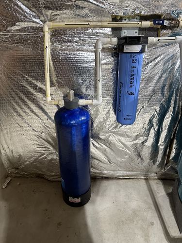 Water softener tank with a Pentair Big Blue whole-house filter