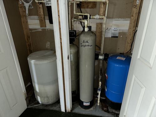 Air injection tank, water softener, and pressure tank installed in a closet
