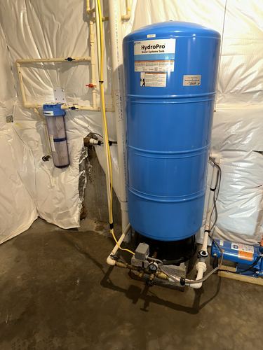 HydroPro pressure tank and whole-house filter installed in a basement