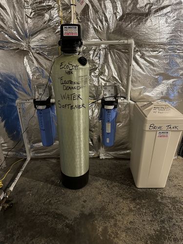 EcoSoft 48K water softener with dual whole-house filters and a brine tank