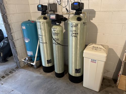 Well-Rite pressure tank, acid neutralizer, EcoSoft 32K water softener, and carbon filter installed together