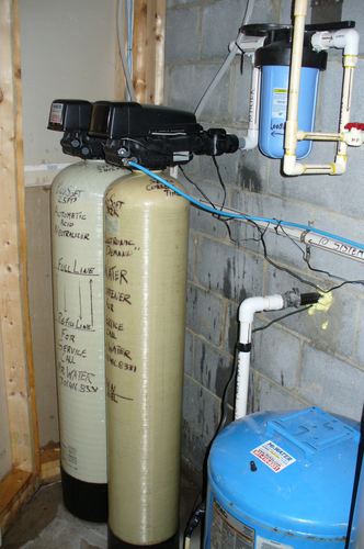 Brine tank installed in a basement