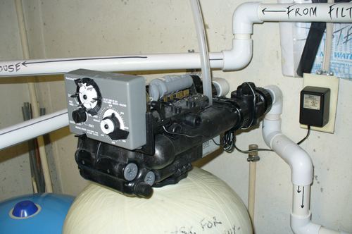 Close-up of a water softener control valve timer dial