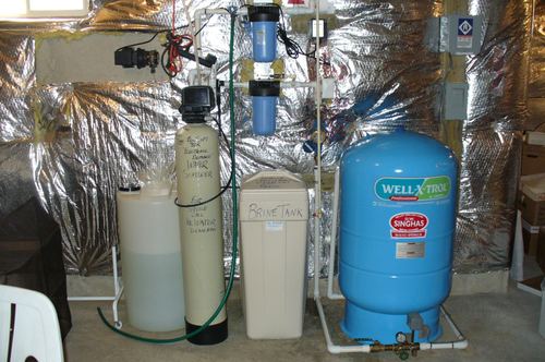 EcoSoft 32K water softener, brine tank, and Well-X-Trol pressure tank installed together