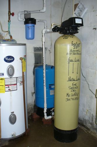 EcoSoft acid neutralizer with a well pressure tank and water heater