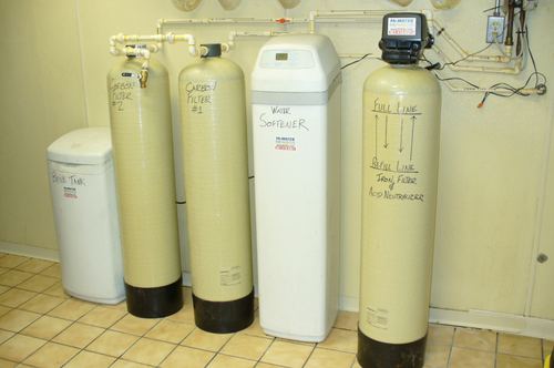 Brine tank, carbon filters, and water softener installed together