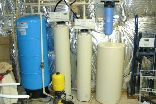 Goulds well pump, Culligan water softeners, and blue pressure tank installed together