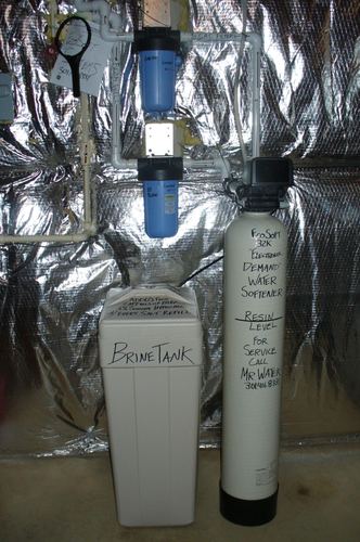Brine tank and EcoSoft 32K water softener with a whole-house filter installed together