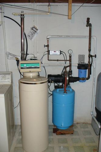 Culligan water softener, well pump, and pressure tank plumbed from a cistern