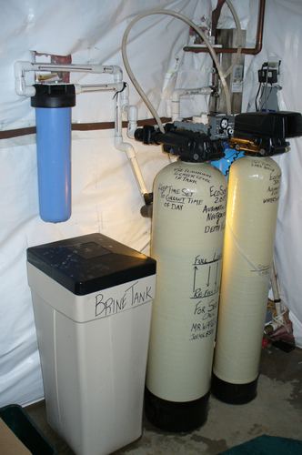 EcoSoft acid neutralizer and water softener with a brine tank and whole-house filter installed together