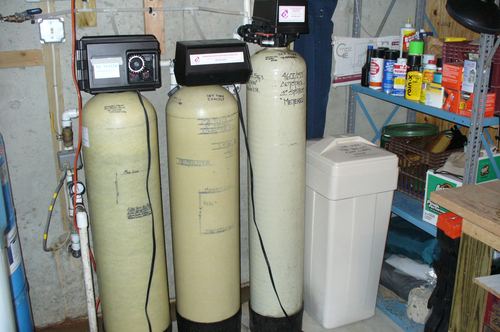 Three water treatment tanks with digital control valves installed together
