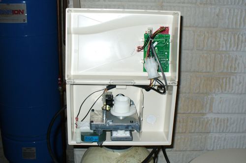 Interior view of a water softener control valve circuit board