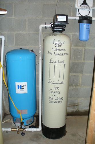 EcoSoft acid neutralizer with a pressure tank and whole-house filters