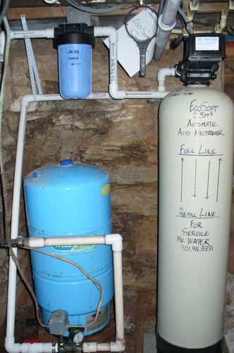 EcoSoft 32K water treatment system with EcoVent, brine tank, and Well-X-Trol pressure tank