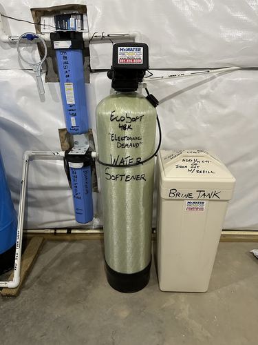EcoSoft 48K water softener with dual whole-house filters and a brine tank