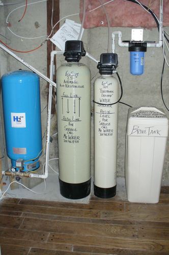 EcoSoft acid neutralizer, water softener, and brine tank with a pressure tank installed together