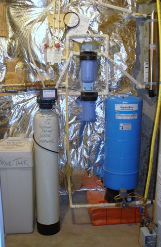 EcoSoft 32K water softener with a HydroPro pressure tank and whole-house filters