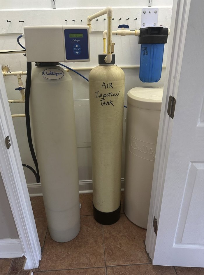 Culligan water softener with an air injection tank installed in a Charles Town, WV home