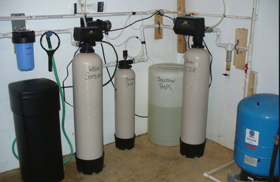 2007 Shepherdstown well water system after Scott added a mixing tank and chlorine solution tank, with water softener and iron filter, treating iron, hardness, sulfur, and manganese